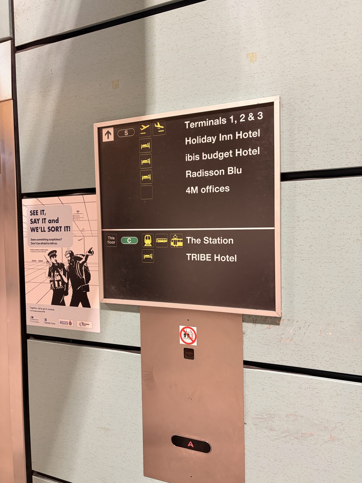 Terminal directions sign showing Tribe Hotel location